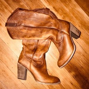 Frye heeled cowboy boots.